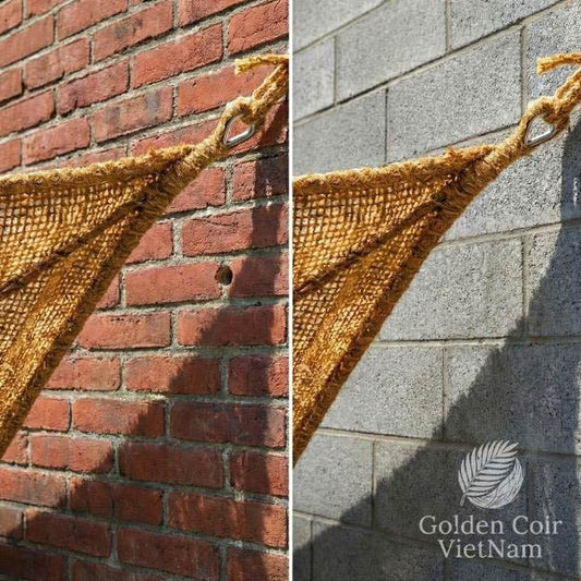 Coir shade sail corner mounted on brick and concrete wall for safe masonry anchoring