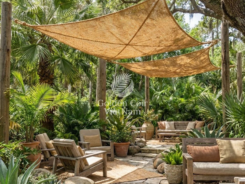Coconut coir shade sail used as permeable architectural mesh creating an open outdoor space without solid roofing