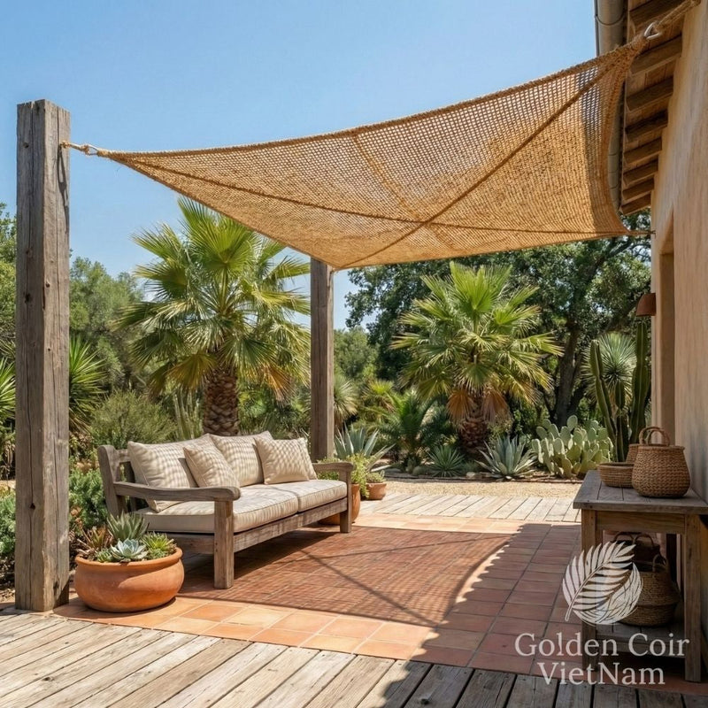 Weave coir shade sail installed in a climate responsive backyard patio system